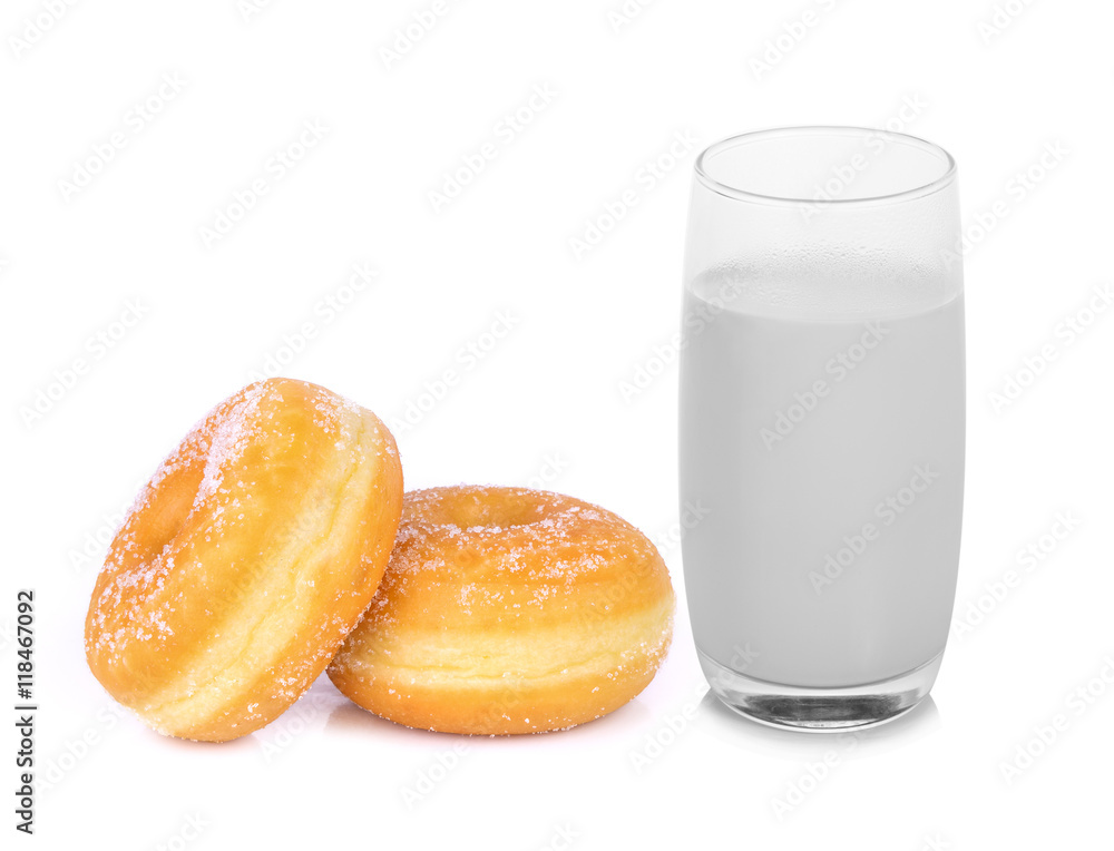 Glass of warm milk and sugar donut isolated on white Glass of warm milk and sugar donut isolated on white