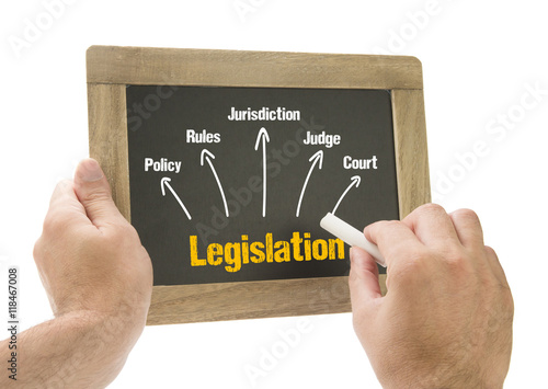 Hand writing Legislation concept on chalkboard