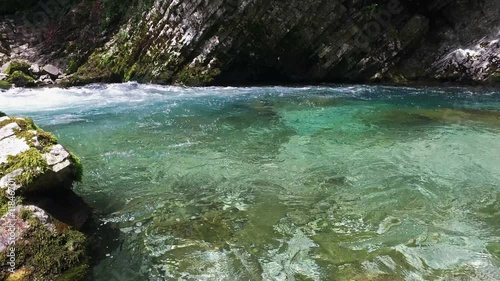 4K. Panoramic view of Radovna river, wich flows in Vintgar Gorge. Clean blue water and green forest. Triglav National Park, Julian Alps, Bled valley, Slovenia, Europe.