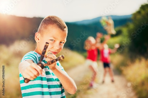 Boy with slingshot