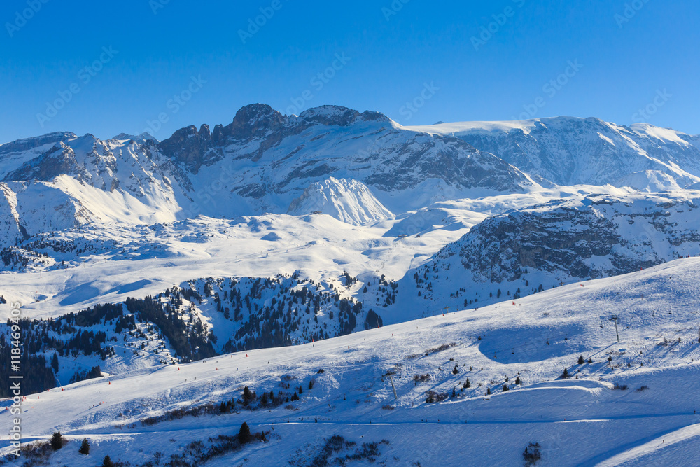 Fototapeta premium View of snow covered Courchevel slope in French Alps. Ski Resort