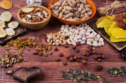 Nuts and dry fruit, in plates, on boards