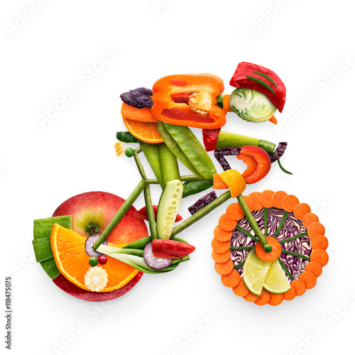 Fruity biker / Healthy food concept of a cyclist riding a bike made of fresh vegetables and fruits, isolated on white.