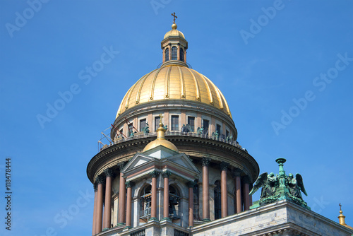 The Dome of St. Isaac's Cathedral on a background of blue summer sky close-up. Saint Petersburg