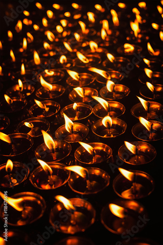 Burning candles in Tibetan Buddhist temple