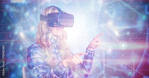 Billede på lærred Composite image of pretty casual worker using oculus rift
