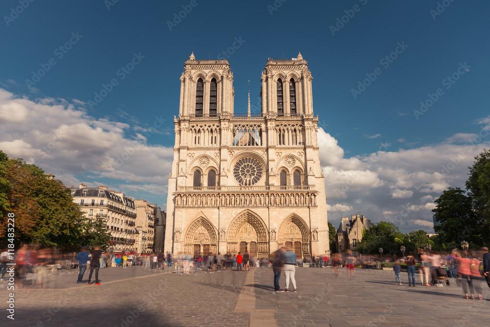 Notre Dame de Paris. France. Ancient catholic cathedral on the quay of a river Seine. Famous touristic architecture landmark in summer
