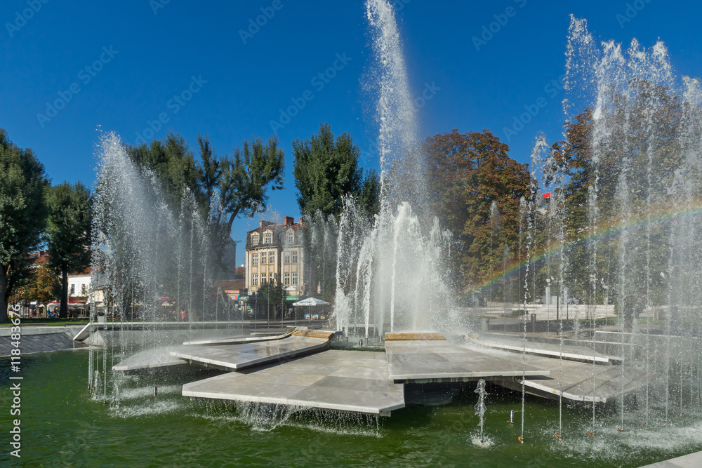 Fototapeta premium Panoramic view of Fountain and rainbow in the center of City of Pleven, Bulgaria