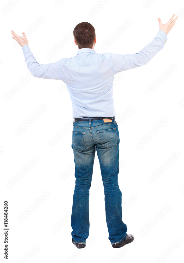 A man in a jacket raised his hands in prayer. Standing young man. Rear view people collection. backside view of person. Isolated over white background. businessman in white shirt raising his hands A man in a jacket raised his hands in prayer. Standing young man. Rear view people collection. backside view of person. Isolated over white background. businessman in white shirt raising his hands