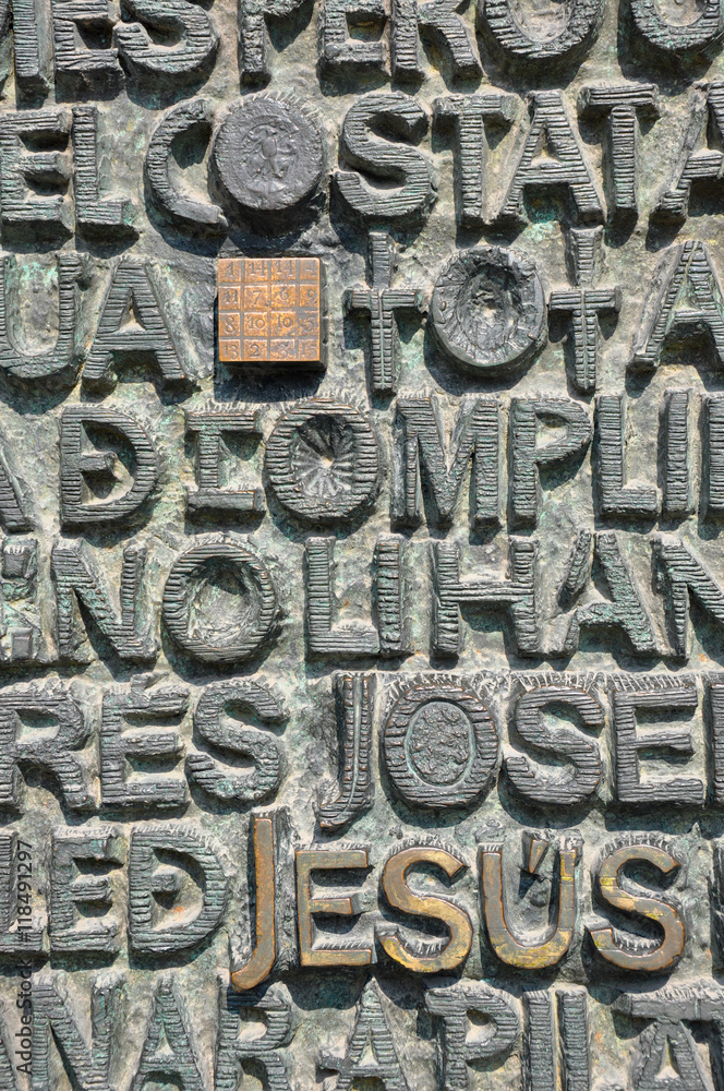 Close up on embossed religious words in stone Close up on embossed religious words in stone