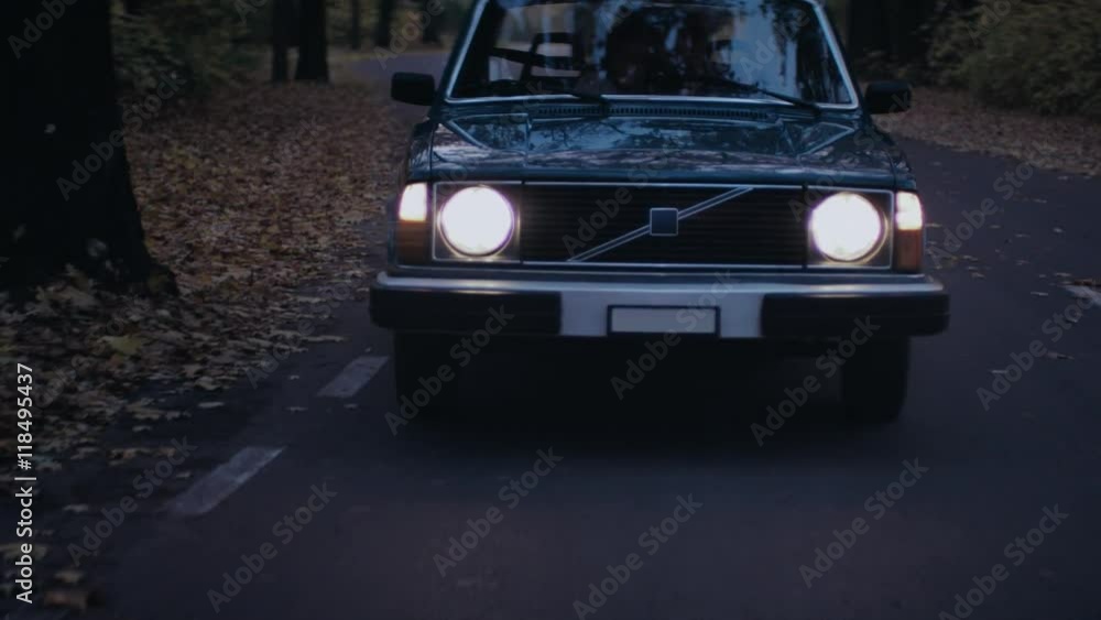 Old car riding a forest path. Foggy day Old car riding a forest path. Foggy day