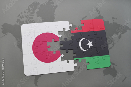puzzle with the national flag of japan and libya on a world map background.