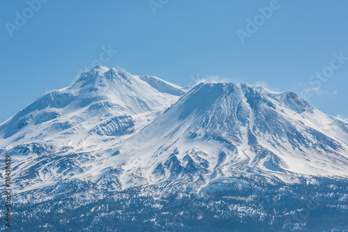 Snowcapped Mount Shasta volcano during winter blue closeup photo