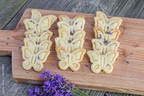 Top View on Butter biscuits cookies with lavender on an oak chop photo