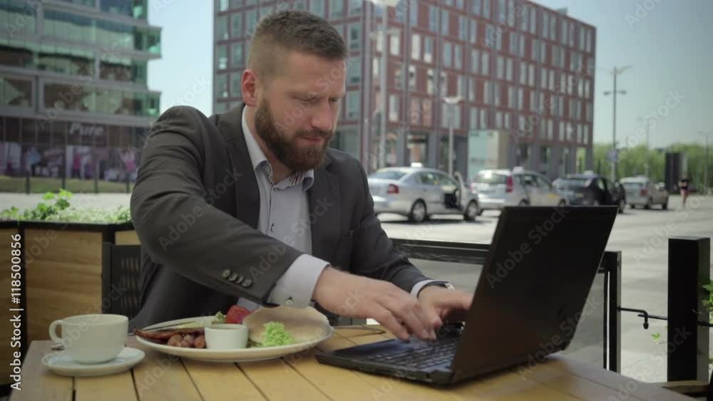 Businessman drinking coffee, answers phone call. He is sitting at the table during lunchtime. He is young and has beard. Man is dressed in suit and shirt.
Businessman drinking coffee, answers phone call. He is sitting at the table during lunchtime. He is young and has beard. Man is dressed in suit and shirt.