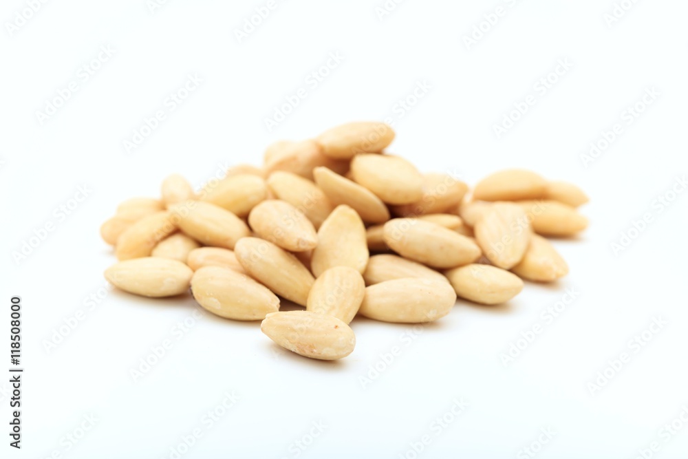 White peeled almonds on white background White peeled almonds on white background
