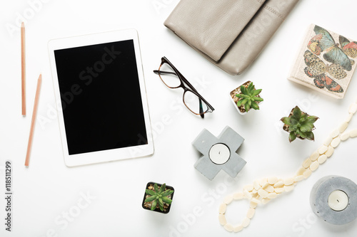 Blank tablet flat lay with desktop objects