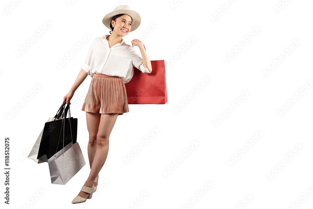Shopaholic- beautiful stylish woman carrying shopping bags and feeling happy on white background with clipping path Shopaholic- beautiful stylish woman carrying shopping bags and feeling happy on white background with clipping path