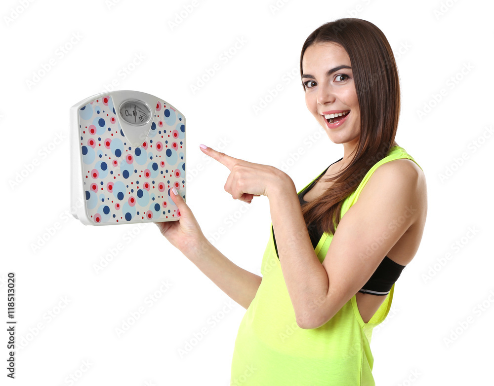 Young beautiful woman with scale isolated on white