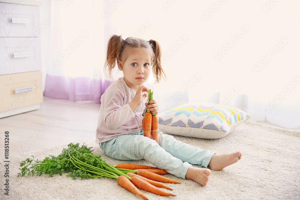 Beautiful girl with carrots at home Beautiful girl with carrots at home