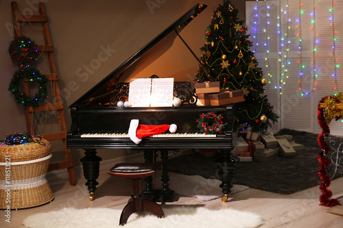Santa hat on piano keys wit...