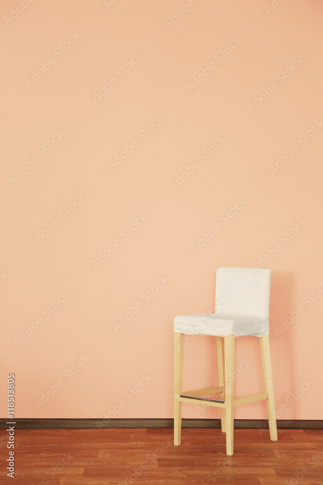 Modern chair on wall background Modern chair on wall background