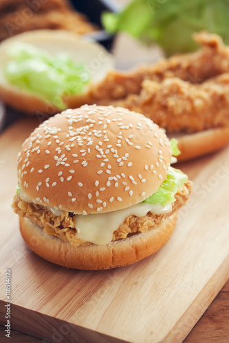 fried chicken burger with sauce for meal  on wooden board