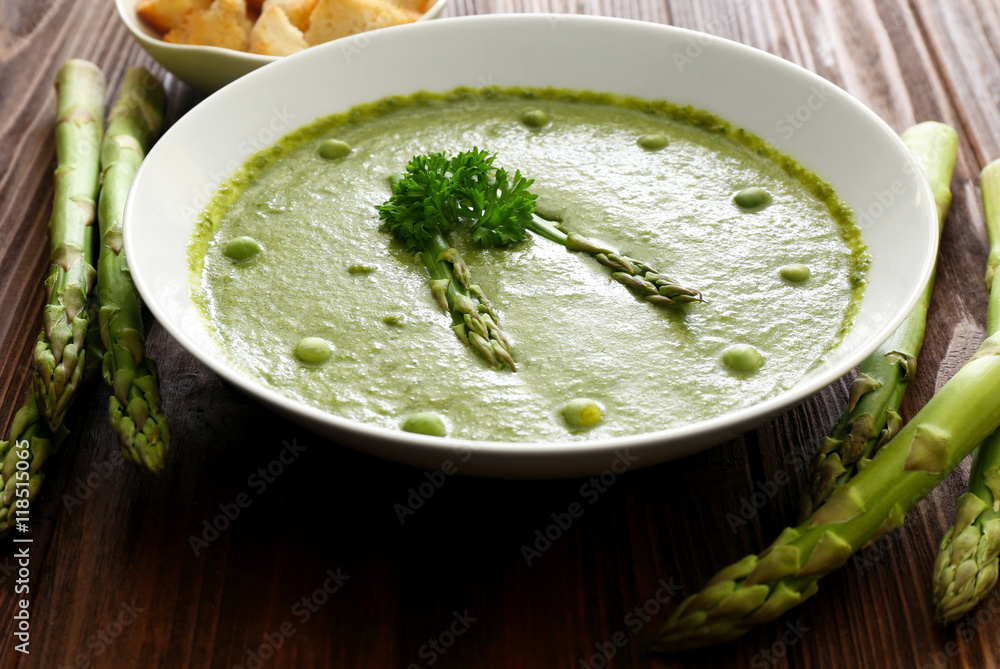 Tasty asparagus soup on table Tasty asparagus soup on table