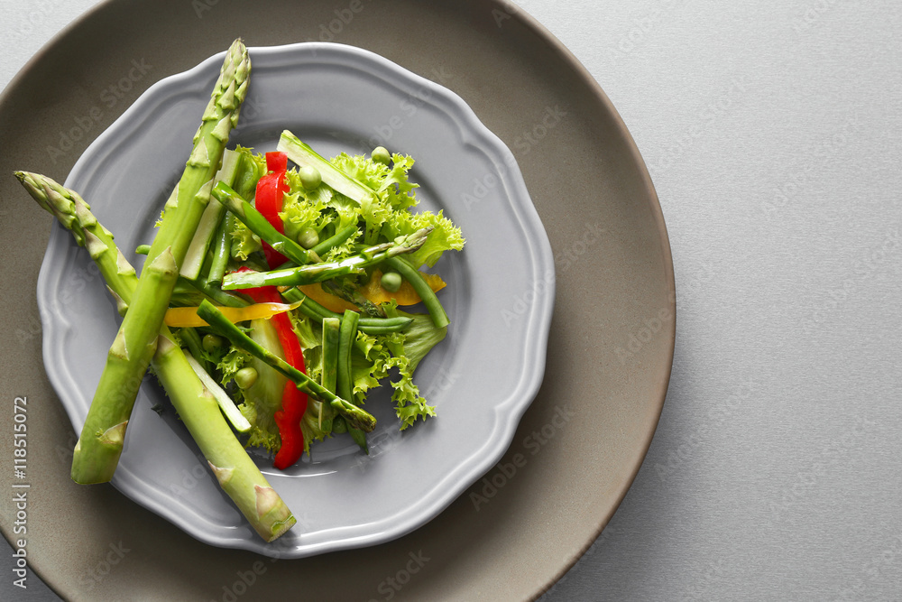 Tasty salad with asparagus and vegetables on plate Tasty salad with asparagus and vegetables on plate