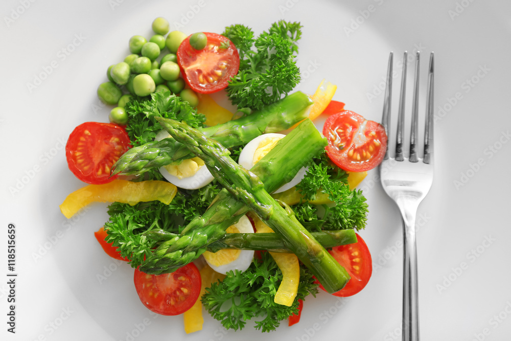 Asparagus with vegetables on plate