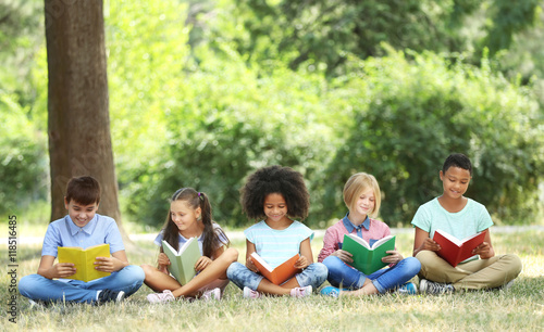 Cute kids reading books in ...