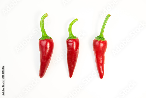 Three ripe red Chilli peppers on white