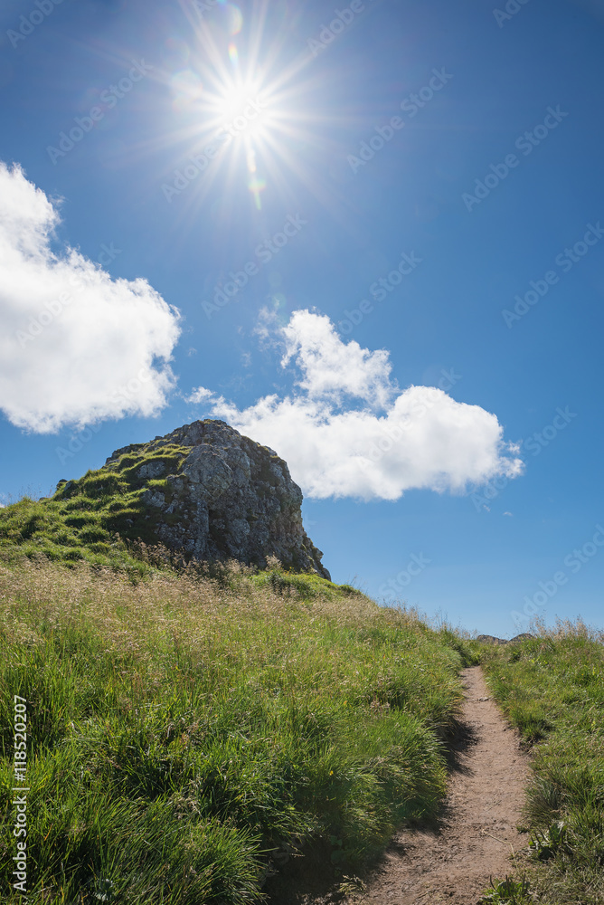 Fototapeta premium mountain trail and bright sunshine