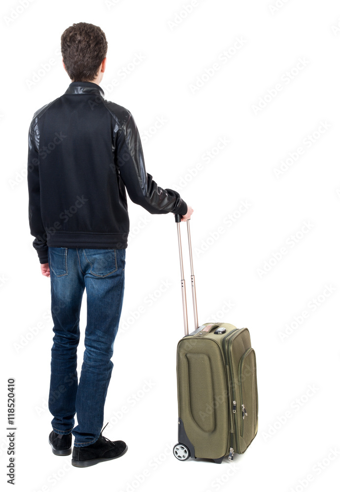 Back view of man with green suitcase looking up. Rear view people collection. backside view of person. Isolated over white background. Curly short-haired guy in a black jacket standing with green Back view of man with green suitcase looking up. Rear view people collection. backside view of person. Isolated over white background. Curly short-haired guy in a black jacket standing with green