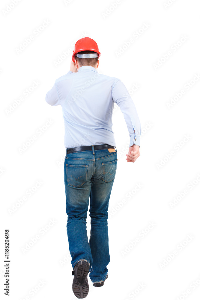 Back view of running engineer in helmet. Walking guy in motion. Rear view people collection. Backside view of person. Isolated over white background. Bearded businessman in a white shirt and a helmet Back view of running engineer in helmet. Walking guy in motion. Rear view people collection. Backside view of person. Isolated over white background. Bearded businessman in a white shirt and a helmet