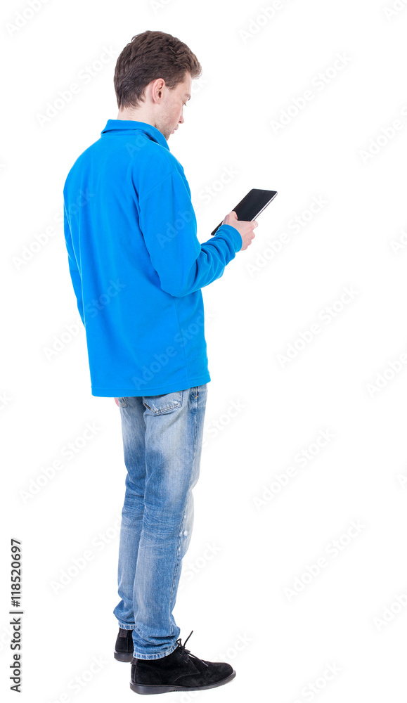 back view of business man uses mobile phone. rear view people collection. Isolated over white background. backside view of person. Curly boy in blue jacket reading an e-book. back view of business man uses mobile phone. rear view people collection. Isolated over white background. backside view of person. Curly boy in blue jacket reading an e-book.