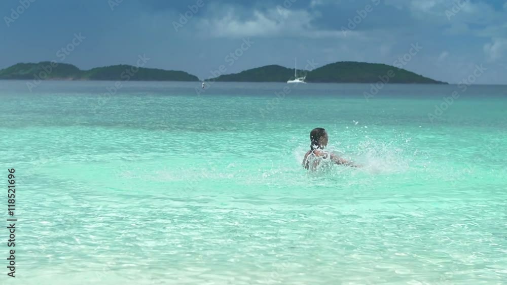 Slow motion video of a woman splashing water on St John, United States Virgin Islands Slow motion video of a woman splashing water on St John, United States Virgin Islands