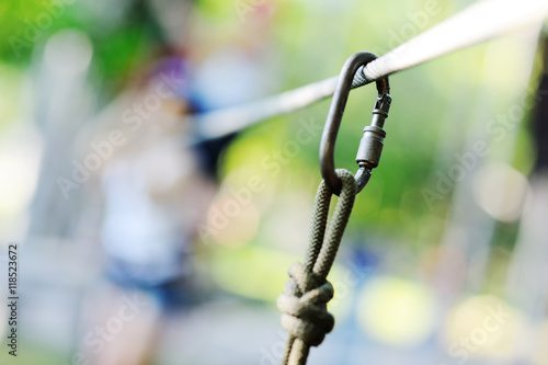 carabiner climbing close-up on a background of a rope-way