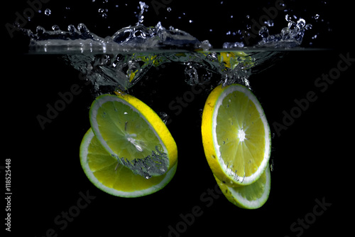 Orange in water on a black background