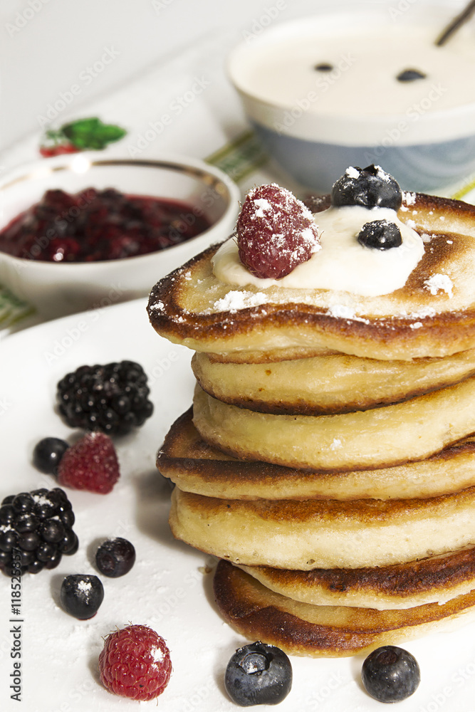 Pancakes with berry, jam and sour cream Pancakes with berry, jam and sour cream