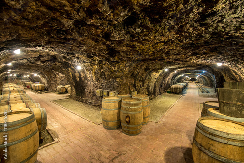 Old wine cellar with oak barrels in Hungary photo