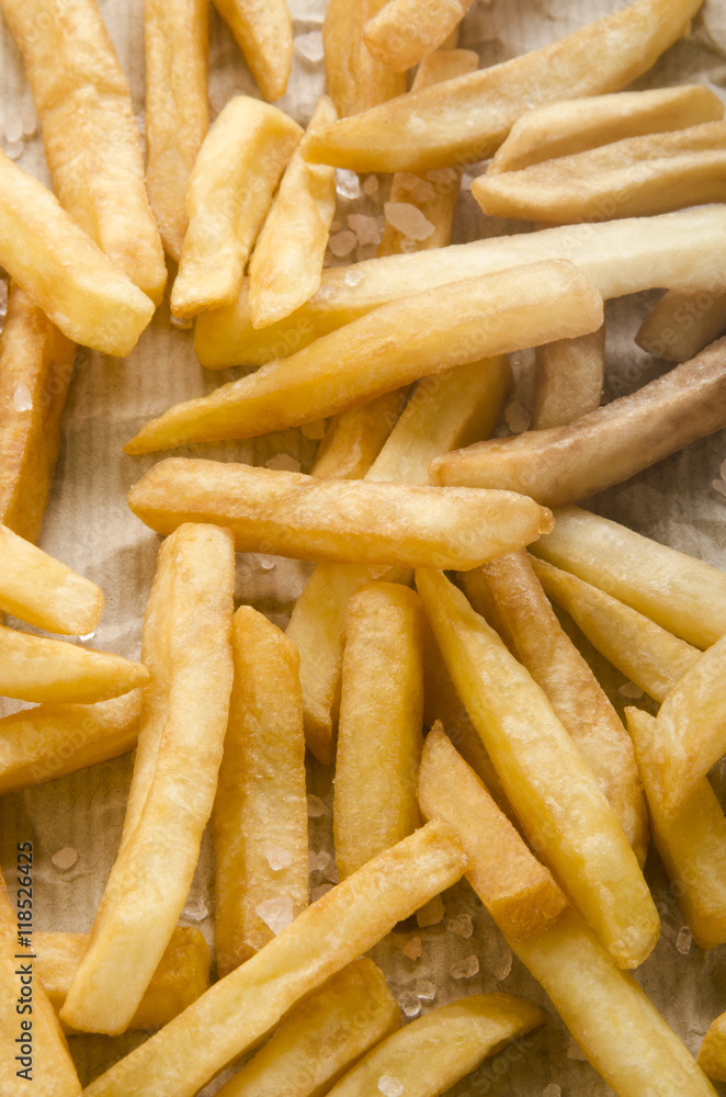 french fries with salt on kitchen paper french fries with salt on kitchen paper