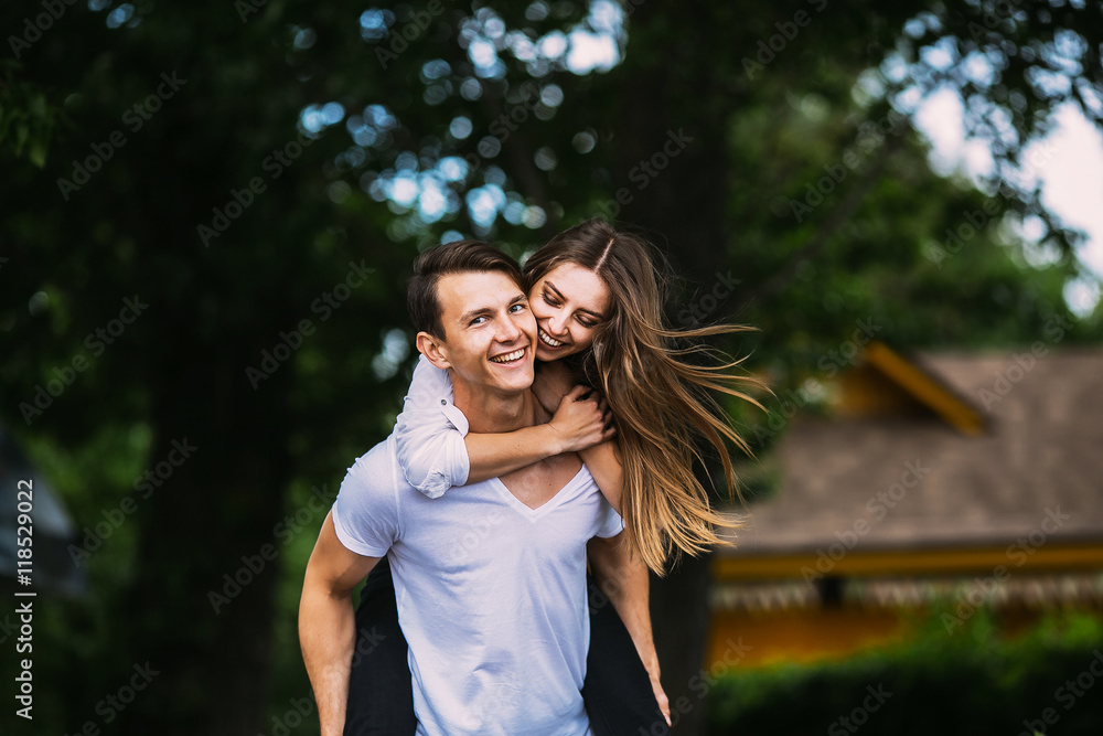 Young adult brunette man and woman in the park Young adult brunette man and woman in the park