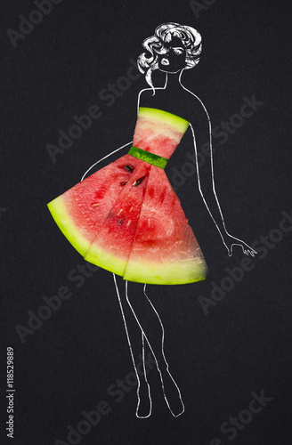 Taste of fashion / Creative concept photo of a watermelon as a dress with illustrated woman on black background.