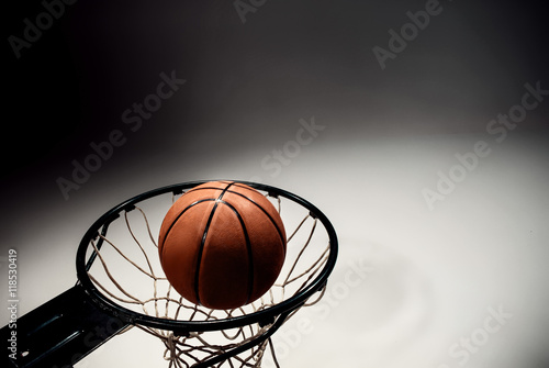 Basketball board and basketball ball on gray background © master1305
