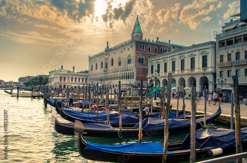 Gondolas on Canal Grande with Piazza di San Marco in the background in Venice, Italy © gatsi