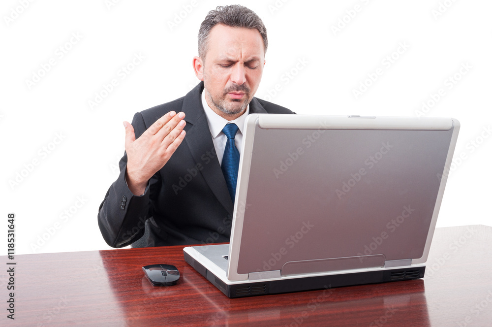 Stressed businessman sweating in his office Stressed businessman sweating in his office