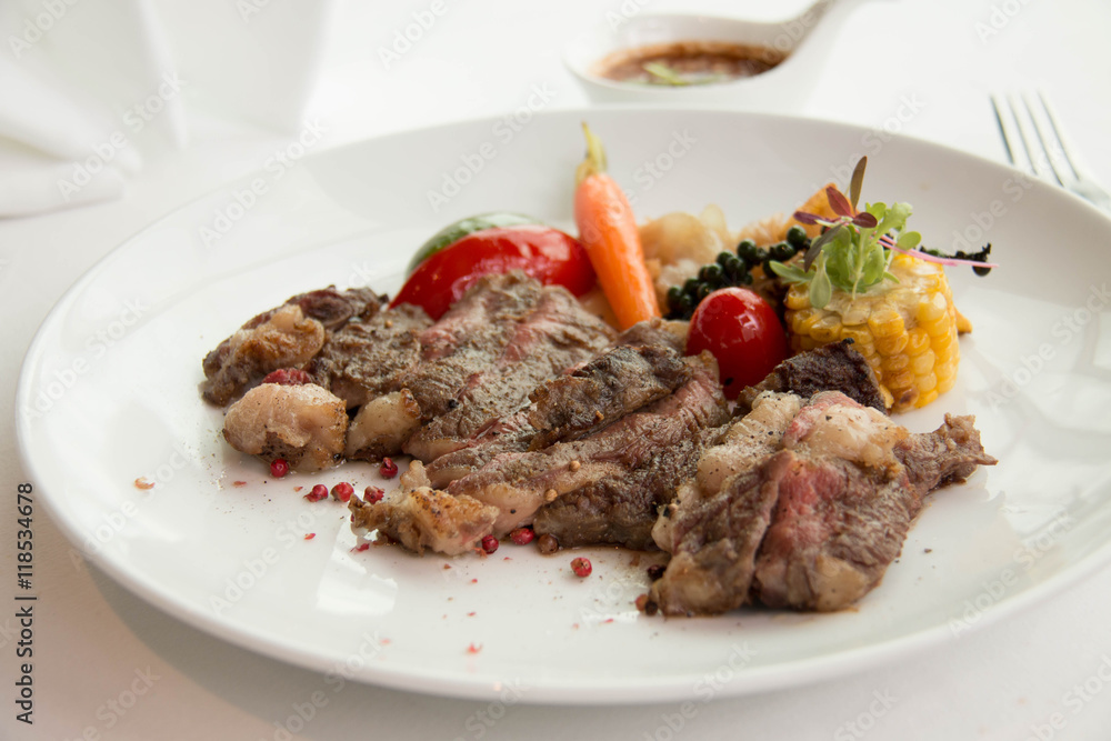  cooked rare sirloin steak  on a white plate