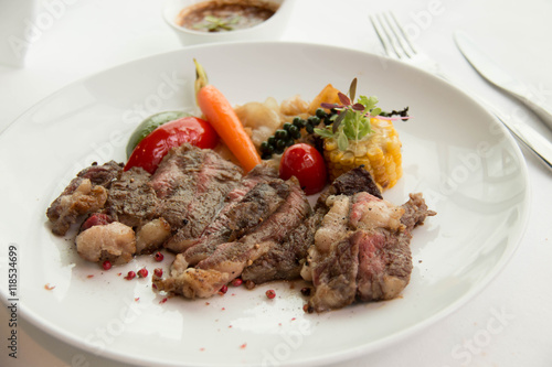  cooked rare sirloin steak on a white plate