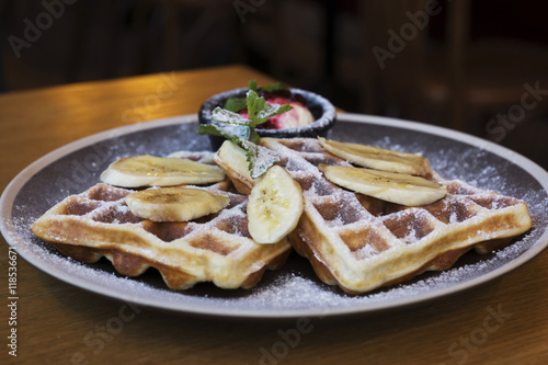 Belgian waffles with ice cream and bananas